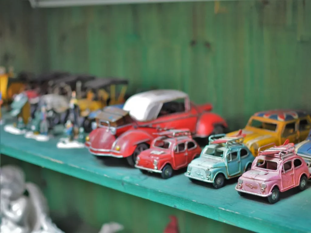 Old toy cars on a shelf