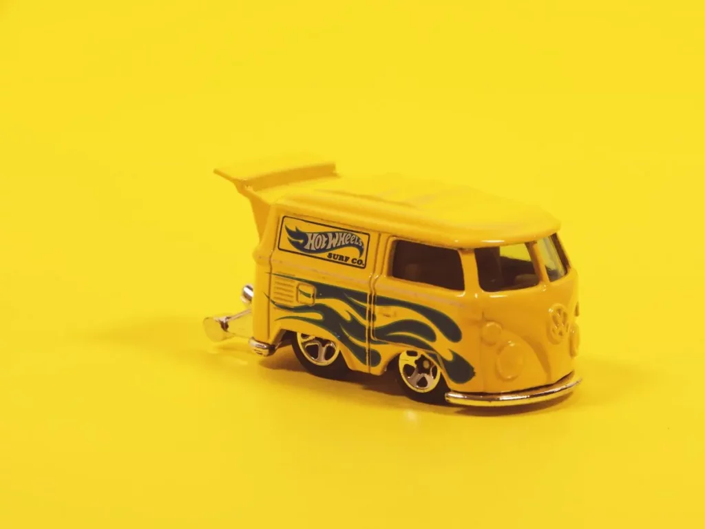 Yellow Hot Wheels VW Bus on yellow background